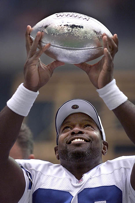 Emmit Smith displays his award for breaking the all-time rushing
record.