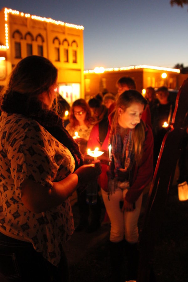 Students and SARA leaders demonstrate against domestic violence in candlelight vigil