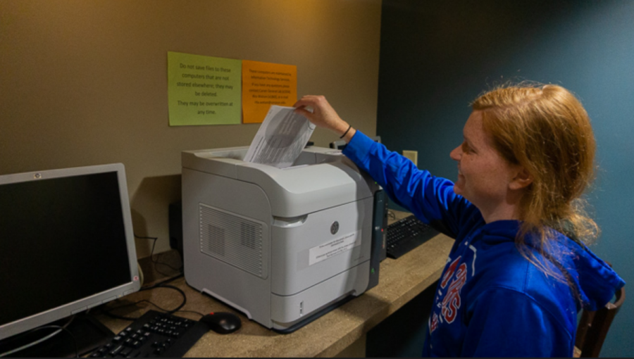 Whitney Kline prints off papers at Kent Campus Center