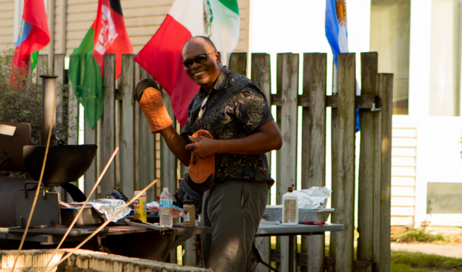 Walter Lain cooks some food on the grill.