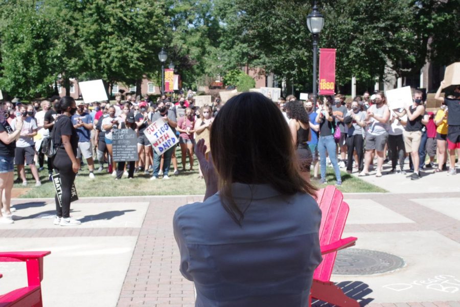 President Kelliher listens to students during the protest march. 