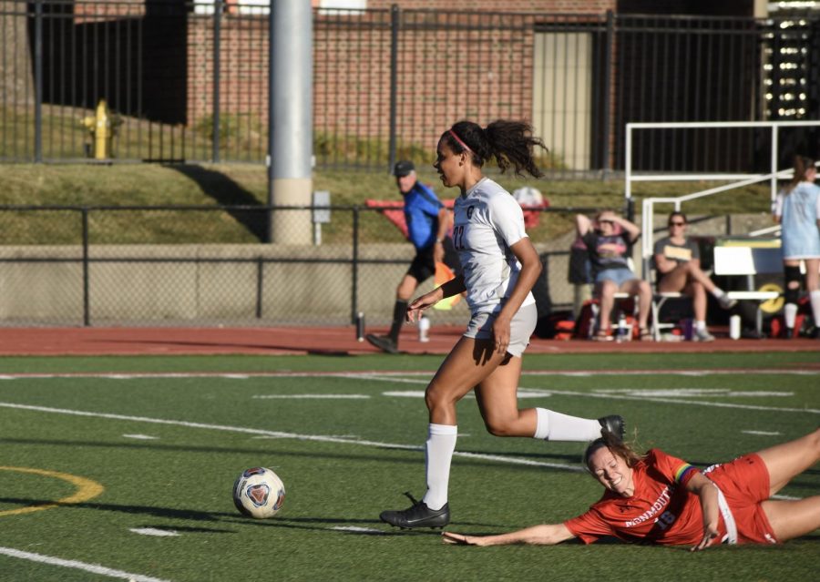 Cassie Nash breaks away from a defender to score a goal against Monmouth College.
