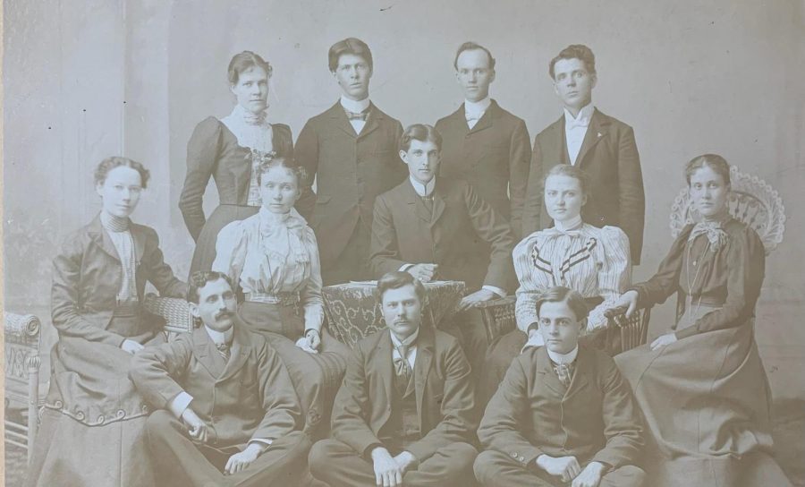 The 1898 staff of The Simpsonian posed for the yearbook photo. Top row (left to right): Josie McCleary; H.L. Youtz; F.R. Sebolt, associate editor; S.M. Holiday, business manager. Middle row: Sadie Shepherd; Jennie Riggs, associate editor; Frank Henderson, editor; Roxanna Stewart, reporter; Lois Todd. Bottom row: James OMay, associate editor; B.W. McEldowney, Y.M.C.A.; J. Well Hancox, athletic editor. 