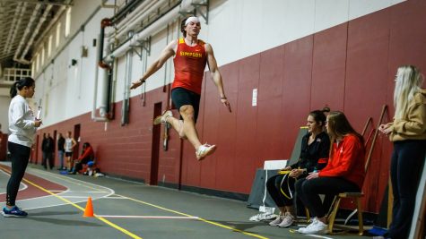 Carter Berkey leaping into a long jump record.

