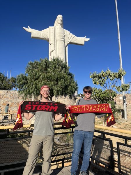 Colin Payton (left) and Mark Pleiss (right) representing their Simpson Storm spirit in front of Cristo de la Concordia located in Cochabamba, Bolivia. 
