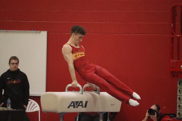 Milo Staley competes in pommel horse at Simpsons first home meet in 2023.
