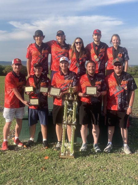 The shooting sports team poses with their Division III National Championship trophy and many individual awards from the National Championship in San Antonio, Texas. 