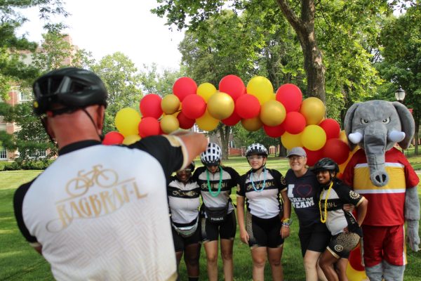 The Dream Team poses with Thunder during RAGBRAI.