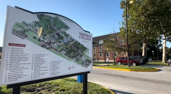 Campus map stands outside Barker Residence Hall, where five students live in former basement classroom.