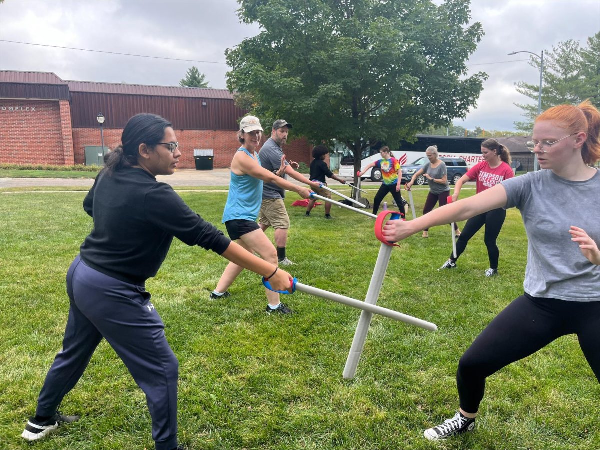 Attendees learn the art of sword play during combat workshop