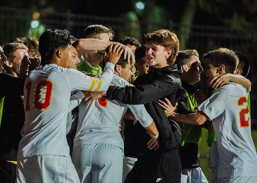 The team celebrates after a goal against Carleton.