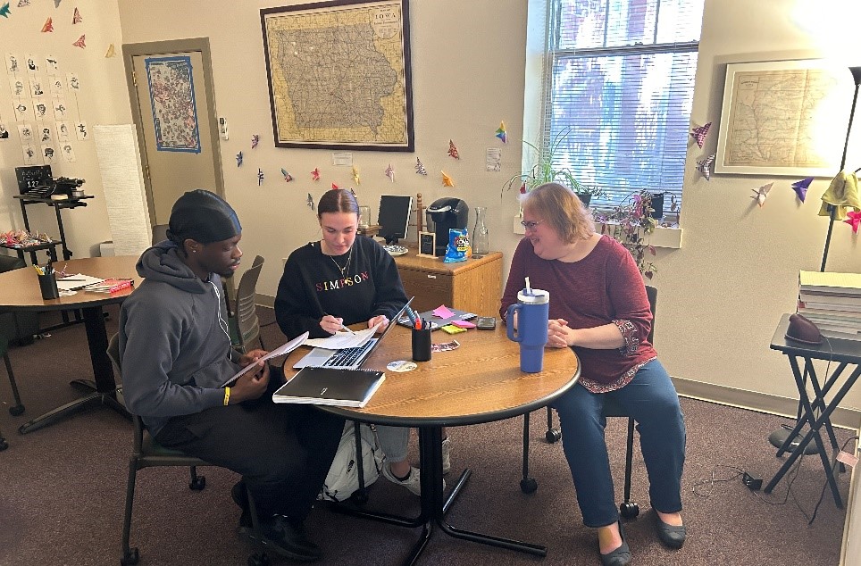 The new writing center director, Jen McGovern (Right), observes writing consultant Peyton Robertson (Middle) tutor student Jacob Zeh (Left).