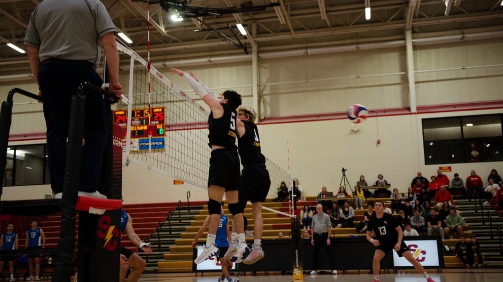 Ignacio Aguado Herranz and Cody Durbin going up for a block.