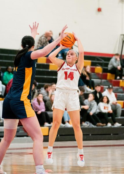 Lutmer pulls up from the elbow for her 1,000th career point