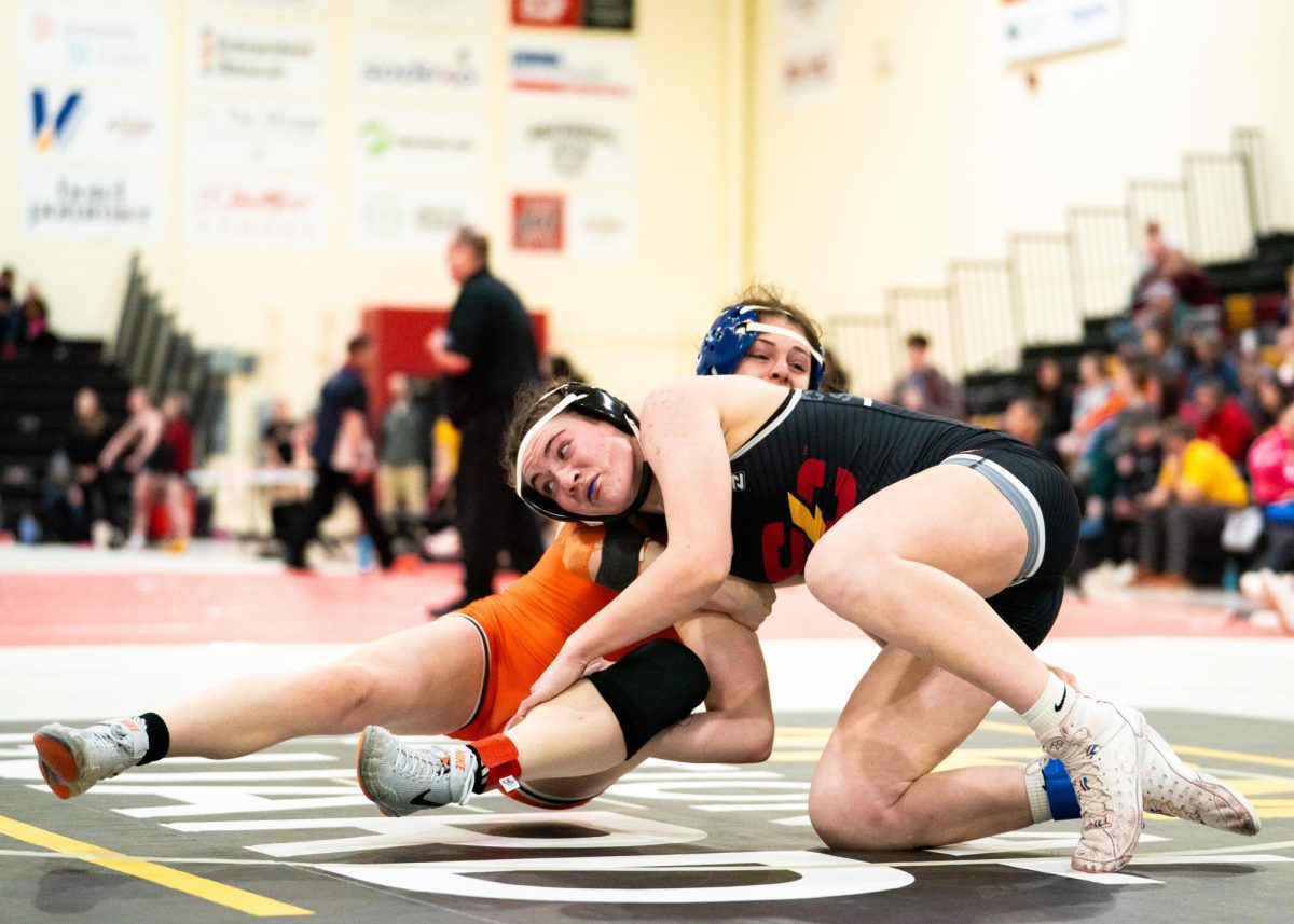 Keeley Kehrli wrestles her opponent.