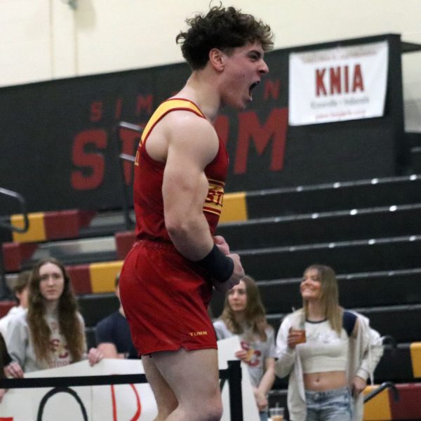 Alex Campbell celebrates after competing his career-high-scoring floor routine.