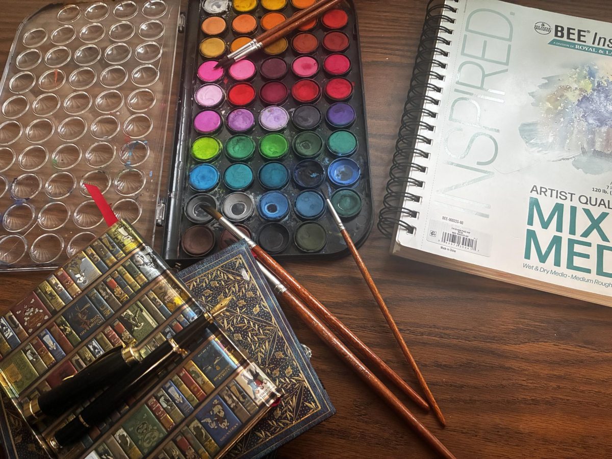 Katelyn’s paints and notebooks for writing
