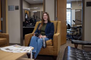 Makayla Paulsen in the student media suite with her camera