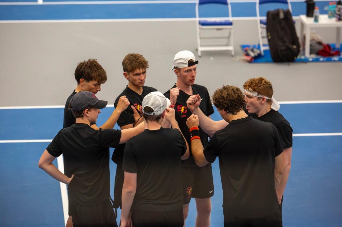 Men’s team huddle before the meet 
