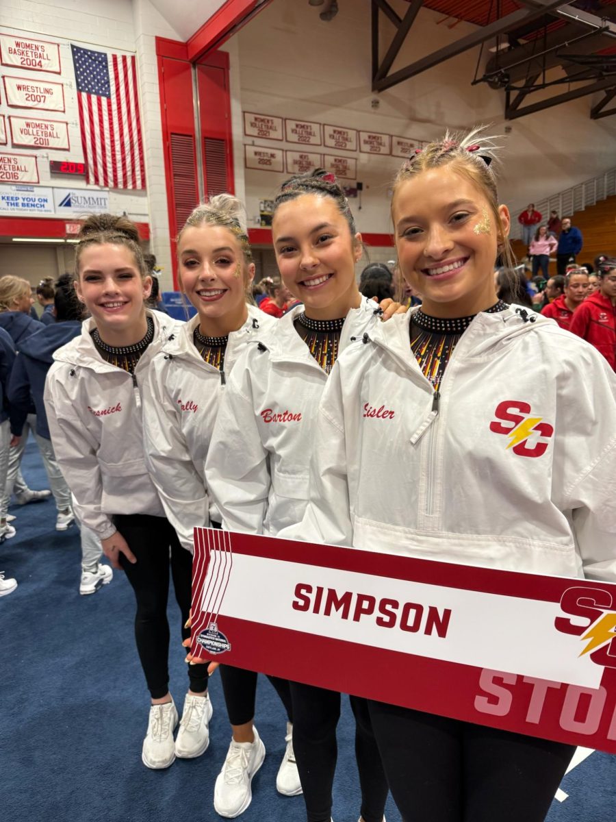 Simpson junior Evalyn Resnick (far left), senior Kaelyn Tally, sophomore Emmie Barton, and junior Liz Sisler (far right) pose during team introductions at NCGA Nationals in Cortland, New York (submitted photo)